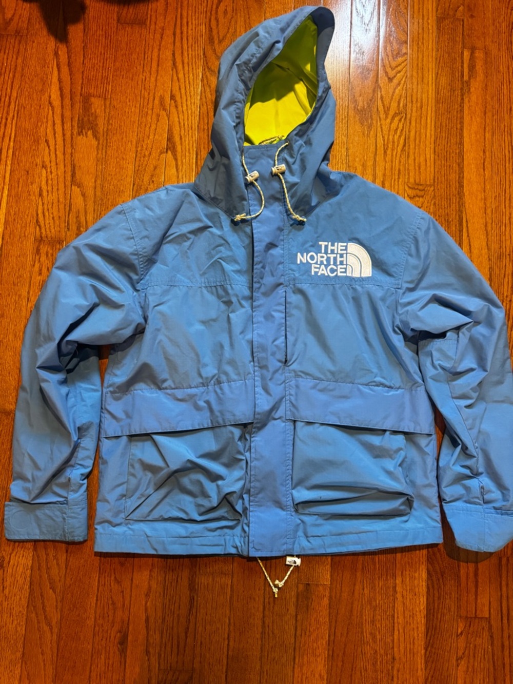 The North Face Light Blue Hooded Jacket with Yellow Lining